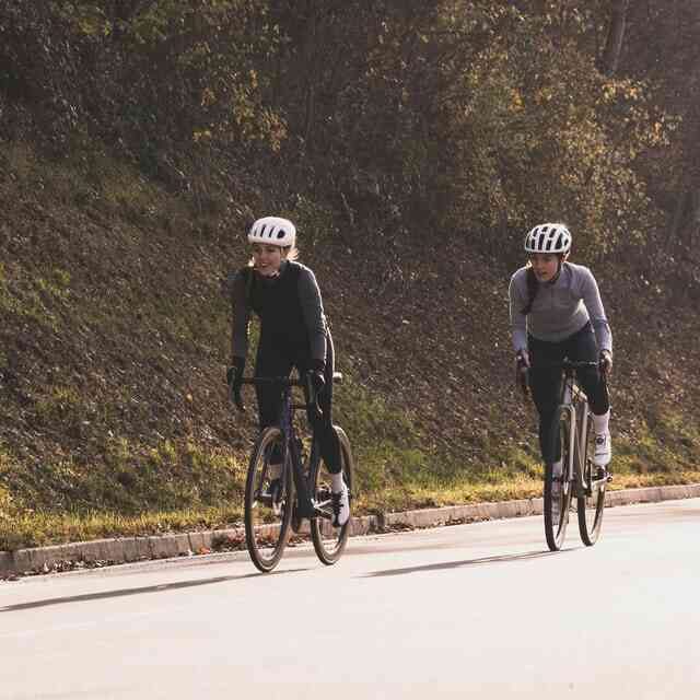 Two girls riding bicycle